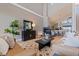 Comfortable living room with ample seating, fireplace and smooth transition into dining area at 218 Sand Key Estates Dr, Clearwater Beach, FL 33767