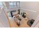 Spacious living room with high ceilings, a fireplace, neutral furniture, and waterfront views at 218 Sand Key Estates Dr, Clearwater Beach, FL 33767