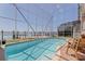 Screened in pool with view of the open bay in a beautiful home at 218 Sand Key Estates Dr, Clearwater Beach, FL 33767