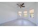 Inviting bedroom featuring tile flooring, a ceiling fan, neutral paint and a bay window at 2234 Nottingham Greens Dr # 2234, Sun City Center, FL 33573