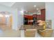 Modern kitchen boasts granite counters, stainless appliances, and a breakfast bar with wicker seating at 2234 Nottingham Greens Dr # 2234, Sun City Center, FL 33573