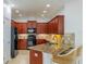 Charming kitchen features granite countertops, stainless steel appliances, and a breakfast bar with seating at 2234 Nottingham Greens Dr # 2234, Sun City Center, FL 33573
