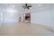 Bright and spacious living area with tile flooring, recessed lighting, and an open layout at 2234 Nottingham Greens Dr # 2234, Sun City Center, FL 33573