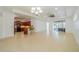 Open-concept living area seamlessly connects to the kitchen, featuring recessed lighting and tile flooring at 2234 Nottingham Greens Dr # 2234, Sun City Center, FL 33573