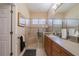Bathroom features a large walk-in shower with a glass door and a vanity with lots of storage at 2286 Sifield Greens Way # 2286, Sun City Center, FL 33573