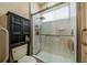 Accessible bathroom offers updated shower with grab bars and built-in shelving for storage at 2286 Sifield Greens Way # 2286, Sun City Center, FL 33573