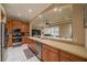Spacious kitchen with stainless steel appliances and a breakfast bar overlooking the living area at 2286 Sifield Greens Way # 2286, Sun City Center, FL 33573