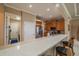 Well-equipped kitchen with stainless steel appliances, breakfast bar, and ample counter space at 2286 Sifield Greens Way # 2286, Sun City Center, FL 33573