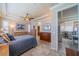Main bedroom with tray ceiling, ample natural light, and easy access to the kitchen at 2286 Sifield Greens Way # 2286, Sun City Center, FL 33573