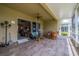 Screened lanai with comfortable seating and view of the golf course at 2286 Sifield Greens Way # 2286, Sun City Center, FL 33573