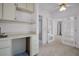 Bedroom with built-in desk and easy access to the bathroom at 2462 Indian E Trl, Palm Harbor, FL 34683