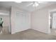 Bedroom with a ceiling fan and a double-door closet at 2462 Indian E Trl, Palm Harbor, FL 34683