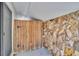 Stone and wooden details are an inviting entrance to a courtyard at 2462 Indian E Trl, Palm Harbor, FL 34683
