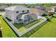 An elevated angle of the backyard with screened-in pool, fence, and greenery at 25631 Bruford Blvd, Land O Lakes, FL 34639