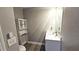 Compact bathroom featuring a modern vanity, sink, and mirror creating a clean and functional space at 25631 Bruford Blvd, Land O Lakes, FL 34639