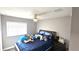 Comfortable bedroom with a ceiling fan and natural light, perfect for relaxation at 25631 Bruford Blvd, Land O Lakes, FL 34639
