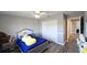 Charming bedroom featuring a plush bed, ceiling fan, and ample closet space at 25631 Bruford Blvd, Land O Lakes, FL 34639