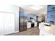 Beautiful kitchen featuring blue cabinets, stainless steel appliances, and attractive countertops at 25631 Bruford Blvd, Land O Lakes, FL 34639