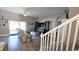 Inviting living room featuring a sliding glass door, comfortable seating, and an entertainment center with decorative elements at 25631 Bruford Blvd, Land O Lakes, FL 34639
