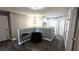 Comfortable loft space with wood-look floors and a stylish black chair at 25631 Bruford Blvd, Land O Lakes, FL 34639