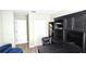 Inviting home office featuring custom built-ins, desk, and a comfortable seating area at 25631 Bruford Blvd, Land O Lakes, FL 34639