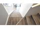 Staircase leading downstairs features luxury vinyl plank flooring at 25631 Bruford Blvd, Land O Lakes, FL 34639
