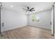 Bright bedroom featuring a modern ceiling fan, window, and wood-look flooring for a serene living space at 2608 W Saint Joseph St # 2, Tampa, FL 33607