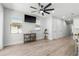 Living room with a ceiling fan, wood flooring, and modern decor at 2608 W Saint Joseph St # 2, Tampa, FL 33607