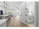 Open-concept living space with wood floors, fan, and access to outdoor patio at 2608 W Saint Joseph St # 2, Tampa, FL 33607