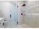 Glass-enclosed shower with black fixtures and tile surround at 2608 W Saint Joseph St # 2, Tampa, FL 33607