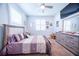 Inviting bedroom with plush carpet, large windows, and stylish furnishings at 2671 Murray Pass, Odessa, FL 33556