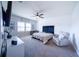 Serene bedroom showcasing stylish accents, a modern crib and a comfy armchair at 2671 Murray Pass, Odessa, FL 33556
