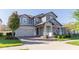 Beautiful two-story home with a well-manicured lawn, attached two car garage, and an inviting brick paved driveway at 2671 Murray Pass, Odessa, FL 33556