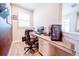 Cozy office space featuring a built-in desk, comfortable chair, modern computer, and a bright window at 2671 Murray Pass, Odessa, FL 33556