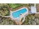 Aerial view of a modern pool with ample lounge seating and landscaping at 2671 Murray Pass, Odessa, FL 33556
