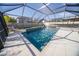Relaxing screened-in pool area with seating; perfect for enjoying the outdoors in comfort and style at 2671 Murray Pass, Odessa, FL 33556