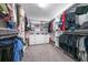 Spacious walk-in closet with custom shelving, drawers, and ample storage space for clothes and accessories at 2671 Murray Pass, Odessa, FL 33556