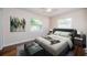 Well-lit bedroom featuring hardwood floors, and neutral walls at 2707 Morningside Dr, Clearwater, FL 33759