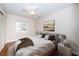 Comfortable bedroom featuring a ceiling fan and a view of the outside at 2707 Morningside Dr, Clearwater, FL 33759