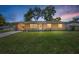 Charming single-story home featuring a well-manicured lawn and inviting curb appeal at 2707 Morningside Dr, Clearwater, FL 33759