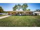Charming single-story home with a well-manicured front lawn and attached one-car garage at 2707 Morningside Dr, Clearwater, FL 33759
