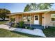 Inviting front porch with landscaping, decorative details, and a well-maintained yard at 2707 Morningside Dr, Clearwater, FL 33759