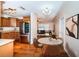 Bright kitchen features wood floors, stainless steel appliances and wood cabinets with a breakfast table at 2707 Morningside Dr, Clearwater, FL 33759