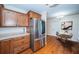Kitchen features stainless steel appliances, wood cabinets and breakfast table at 2707 Morningside Dr, Clearwater, FL 33759