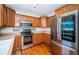 Kitchen features stainless steel appliances and wooden cabinets at 2707 Morningside Dr, Clearwater, FL 33759