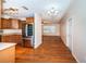 Bright kitchen features wood floors, stainless steel appliances and wood cabinets at 2707 Morningside Dr, Clearwater, FL 33759