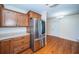 Kitchen features stainless steel appliances, wood cabinets and breakfast table at 2707 Morningside Dr, Clearwater, FL 33759