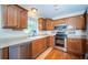 Kitchen features stainless steel appliances, window and wooden cabinets at 2707 Morningside Dr, Clearwater, FL 33759