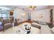 Stylishly furnished living room featuring a neutral color palette, modern furniture, and hardwood floors at 2707 Morningside Dr, Clearwater, FL 33759