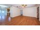 Spacious living room with hardwood floors, ceiling fan, and neutral color scheme at 2707 Morningside Dr, Clearwater, FL 33759